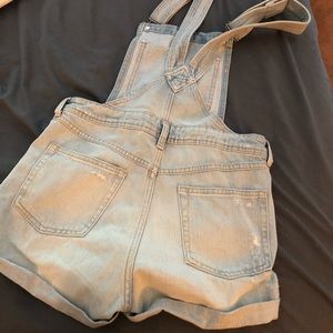 Overall shorts.